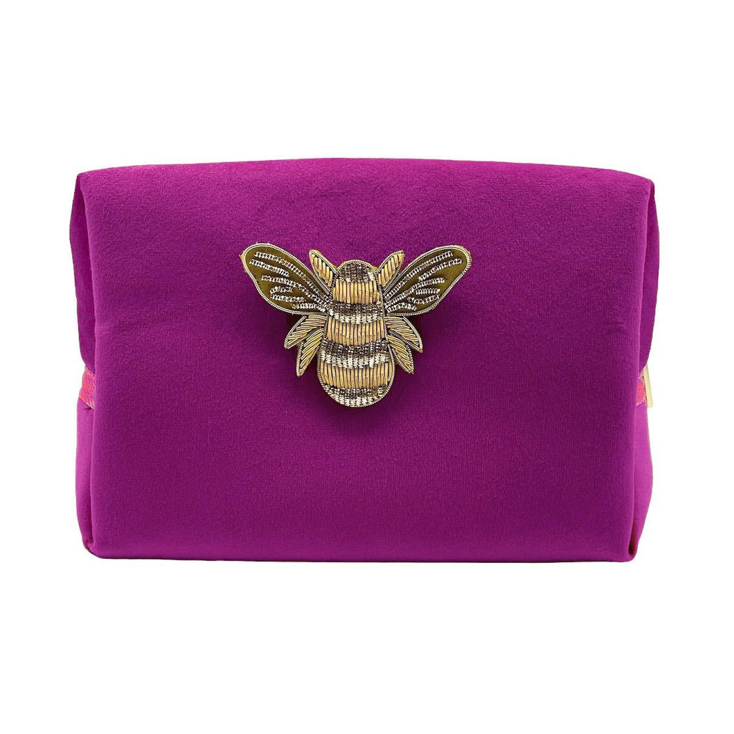 Trousse fuchsia avec broche abeille dorée